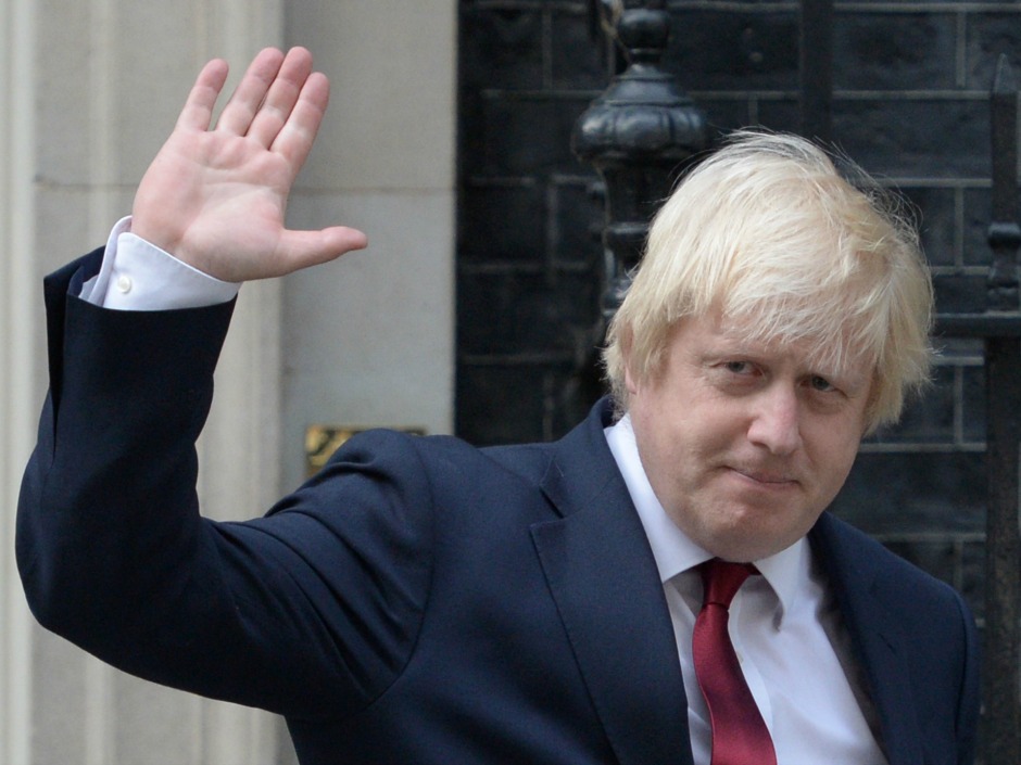 Newly appointed U.K. Foreign Secretary Boris Johnson waves as he leaves 10 Downing Street in London on Wednesday