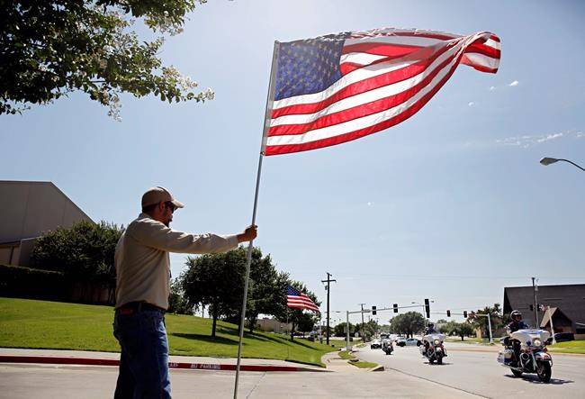 Dallas shooting victims: three police officers identified as colleagues mourn