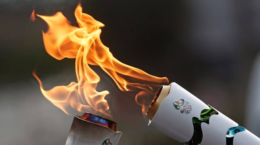 Rio Olympics: Watch a Man Trying to Extinguish Torch in Brazil