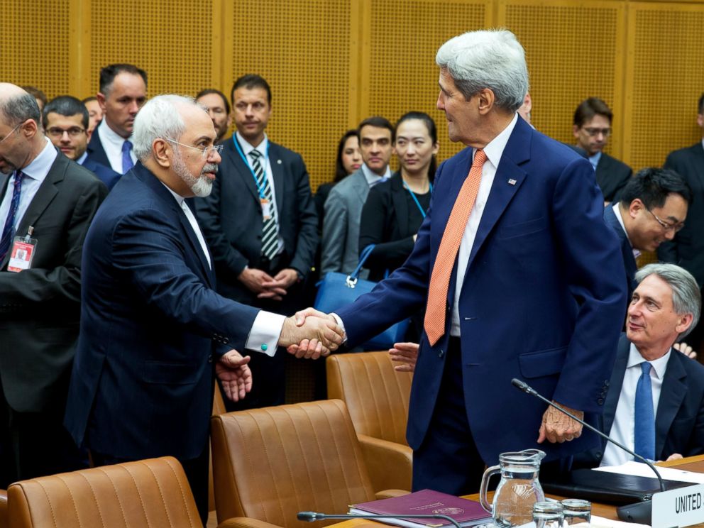 Iran Mohammad Javad Zarif shakes hands with US Secretary of State John Kerry at the last working session of nuclear negotiations