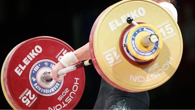 Thomas SheaA weightlifter hoisting a barbell