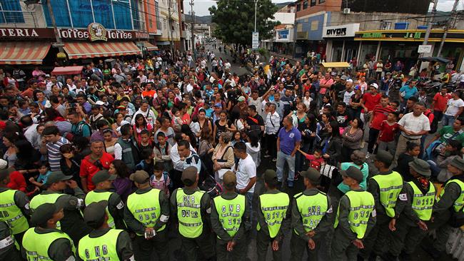 Venezuelans wait for their turn in San Antonio del Tachira Venezuela to cross to Cucuta in Colombia through the Simon Bolivar bridge to buy supplies