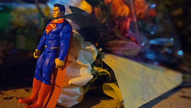 A Superman figure and flowers are left at the entrance to the Our Lady of the Lake Regional Medical Center in Baton Rouge. Several officers were rushed to the hospital after the Sunday attack