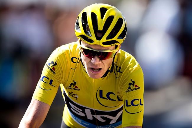 Britain's Chris Froome wearing the overall leader's yellow jersey crosses the finish line of the eleventh stage of the Tour de France cycling race over 162.5 kilometers with start in Carcassonne and finish in Montpellier France W