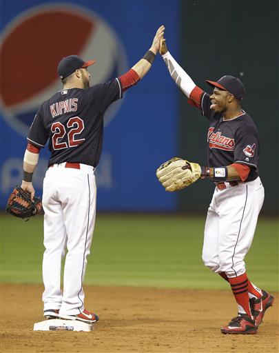 Jason Kipnis left and Rajai Davis celebrate after the Indians defeated the Detroit Tigers 12-1 in a baseball game Tuesday