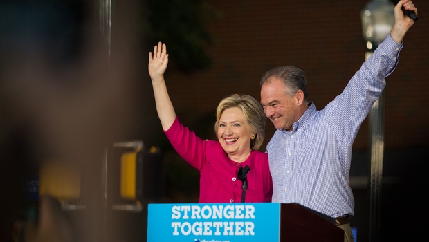 Democratic presidential candidate Hillary Clinton and vice presidential candidate Tim Kaine wave during a rally at Broad Street Market in Harrisburg Pa. Friday