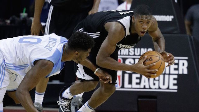 Minnesota Timberwolves Kris Dunn right battles for the ball with Denver Nuggets Emmanuel Mudiay during the second half of an NBA summer league basketball game. AP