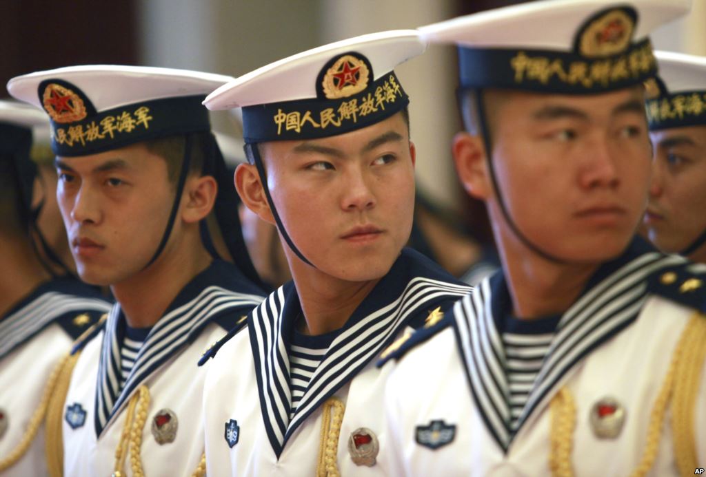 FILE- Members of a military honor guard are seen at People's Liberation Army Navy headquarters outside Beijing China