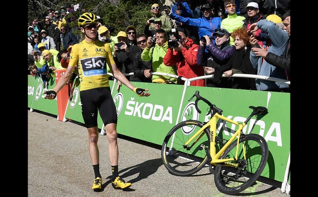 Britain's Chris Froome wearing the overall leader's yellow jersey reacts after he crashed at the end of the twelfth stage of the Tour de France cycling race with start in Montpellier and finish six kilometers before the Mont Ventoux