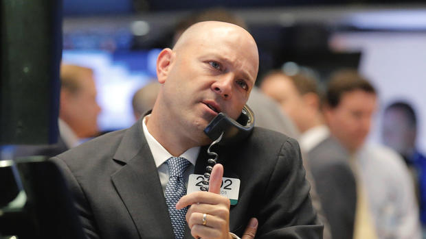 Traders work on the floor of the New York Stock Exchange in New York City U.S