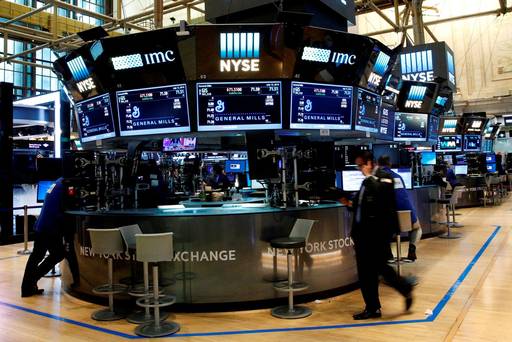 Traders work on the floor of the New York Stock Exchange on Tuesday