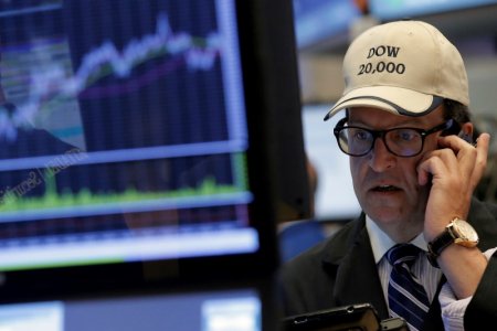 Traders work on the floor of the New York Stock Exchange in New York City U.S