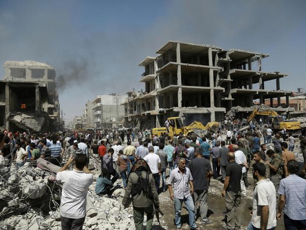 IS claims responsibility for attack on Syrian town, 22 dead