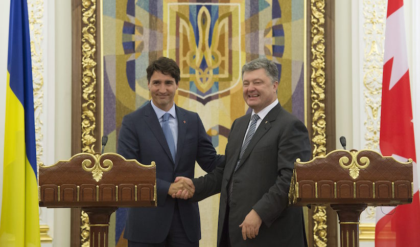 Prime Minister Justin Trudeau left and Ukrainian President Petro Poroshenko share a laugh at the end of joint news conference at the Presidential Administration building in Kyiv Ukraine Monday