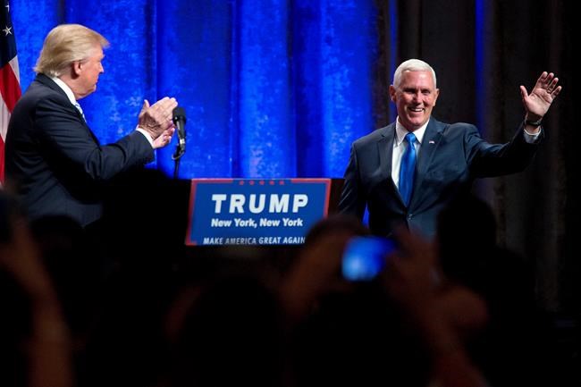 Republican presidential candidate Donald Trump left introduces Gov. Mike Pence R-Ind. during a campaign event to announce Pence as the vice presidential running mate on Saturday