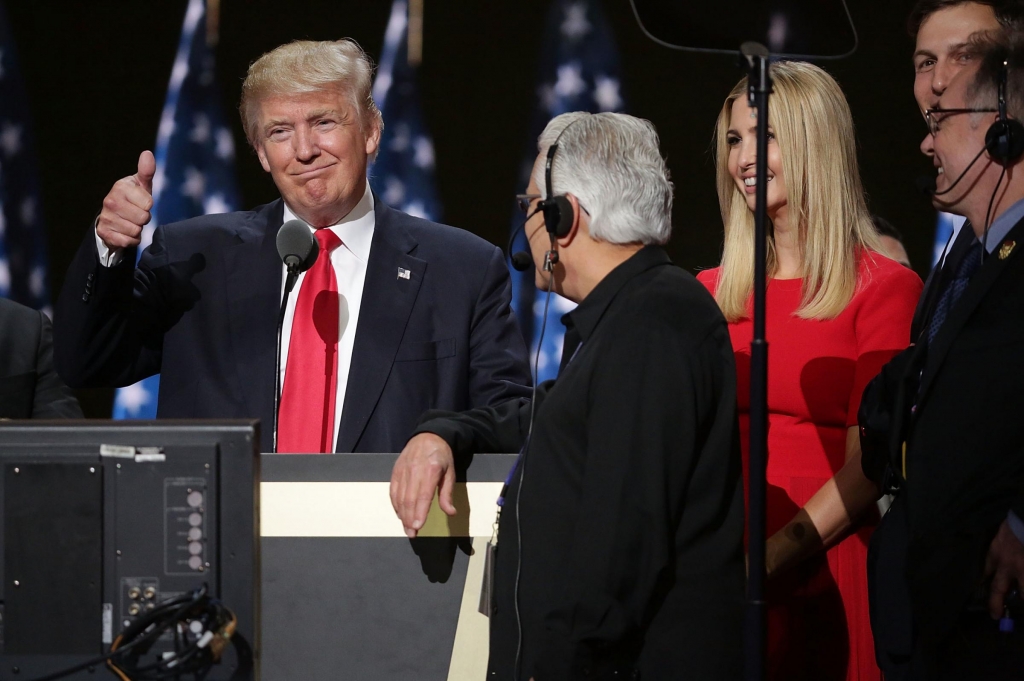 Republican presidential candidate Donald Trump and his daughter Ivanka test the teleprompters and microphones on stage before the start of the final day of the Republican National Convention