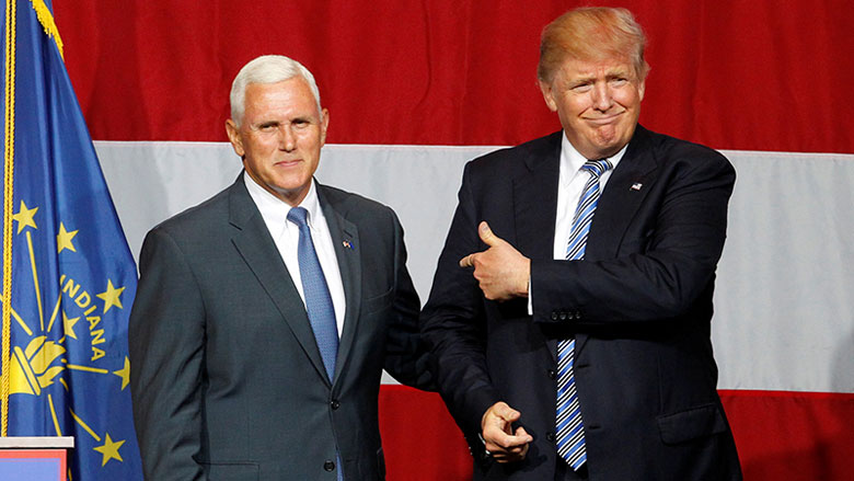 Indiana Gov. Mike Pence left and Republican presidential candidate Donald Trump wave to the crowd during a campaign stop at the Grand Park Events Center in Westfield Ind