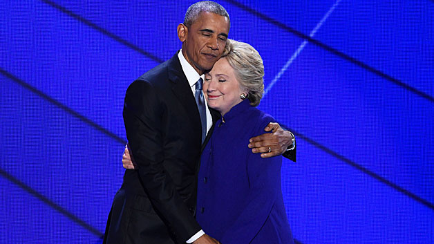 President Barack Obama and Hillary Clinton embrace on stage at the Democratic National Conventi