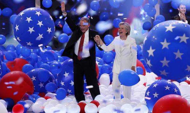 Democratic vice presidential nominee Sen. Tim Kaine D-Va. and Democratic presidential nominee Hillary Clinton walk through the falling balloons during the final day of the Democratic National Convention in Philadelphia, Thursday