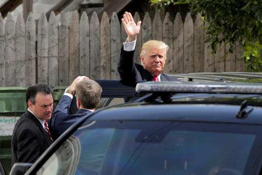 Republican U.S. presidential candidate Donald Trump waves after meeting with House Republican members in Washington D.C