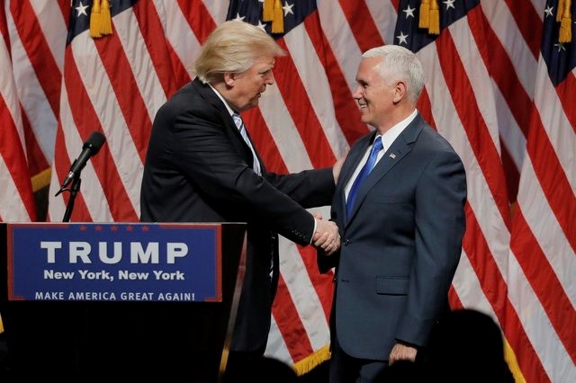 Republican U S presidential candidate Donald Trump greets Indiana Governor Mike Pence R as he introduces Pence as his vice presidential running mate in New York City U S July 16 2016 REUTERS Brendan McDermid