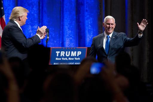 Republican presidential candidate Donald Trump left introduces Gov. Mike Pence R-Ind. during a campaign event to announce Pence as the vice presidential running mate on Saturday