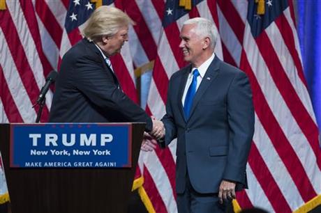 Republican presidential candidate Donald Trump right introduces Gov. Mike Pence R-Ind. during a campaign event to announce Pence as the vice presidential running mate on Saturday