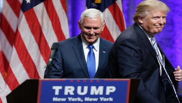 Donald Trump steps away after greeting Indiana Governor Mike Pence during the introduction of Pence as his vice presidential running mate in New York City U.S