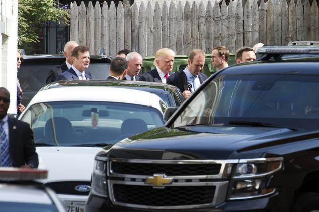 Republican presidential candidate Donald Trump departs a meeting with Republican House members at the Capitol Hill Club in Washington Thursday