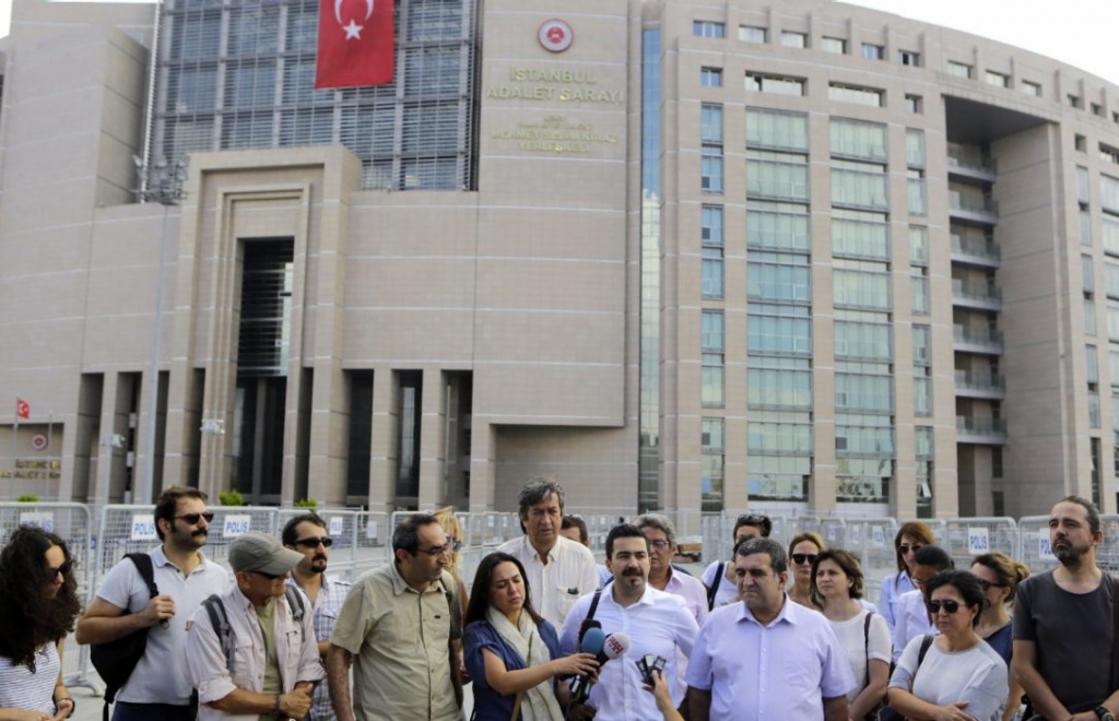 Turkish journalists gather outside a court building to support their colleague journalist Bulent Mumay who was detained Tuesday in connection with the investigation launched into the failed coup attempt in Istanbul. Forty-seven more journalists were tar