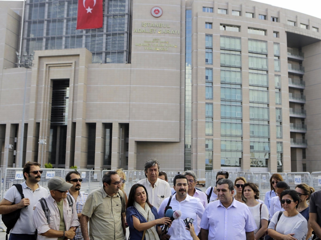 Journalists gather outside a court building to support journalist Bulent Mumay who was detained Tuesday in connection with the investigation of the attempted coup in Turkey