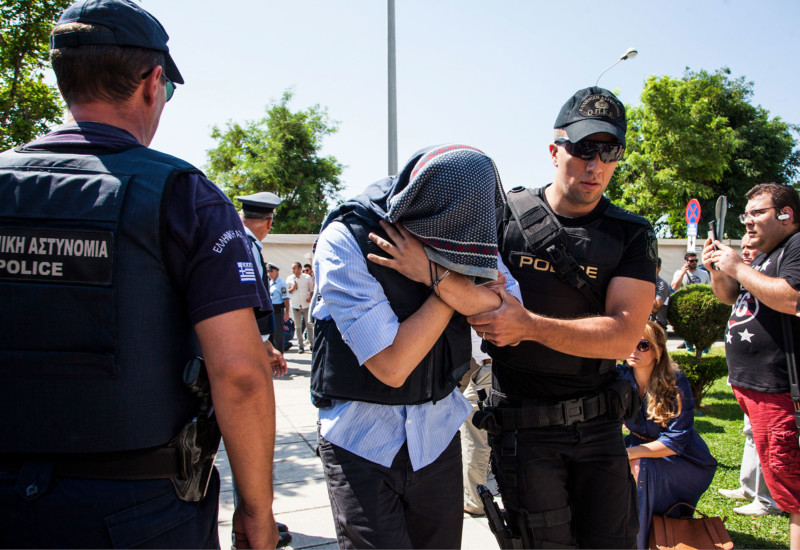 A Turkish military officer is transferred to a court hall in the city of Alexandroupolis northern Greece Thursday