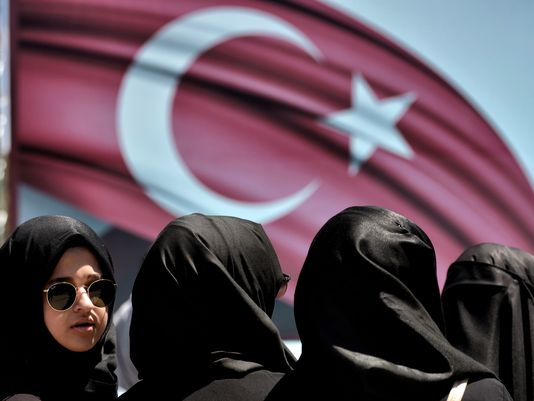 A woman looks on during a demonstration in support of Turkey's President Erdogan at the Sarachane park in Istanbul