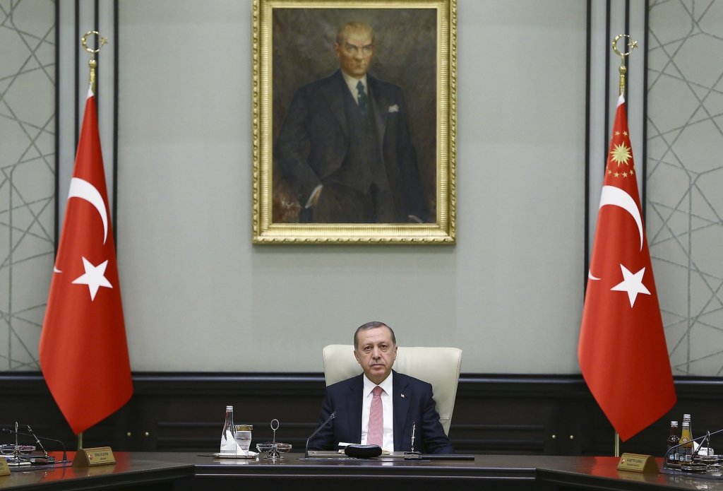 Under a portrait of Turkish Republic founder Mustafa Kemal Ataturk,Turkey's President Recep Tayyip Erdogan chairs the cabinet meeting in Ankara Turkey Monday