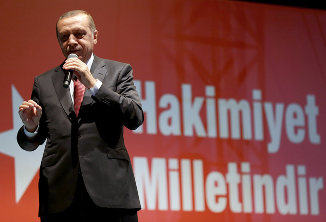 Turkey's President Recep Tayyip Erdogan addresses his supporters gathered in front of his residence in Istanbul early Tuesday