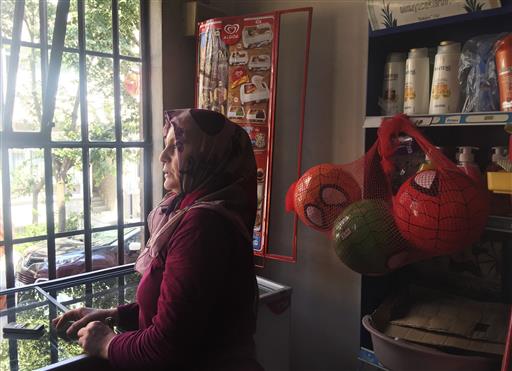 Semiha Pacal 50 who grew up in the same building where Turkey's President Recep Tayyip Erdogan lived for a good 20 years as a young man before he became mayor of the city stands in her store in Istanbul Monday