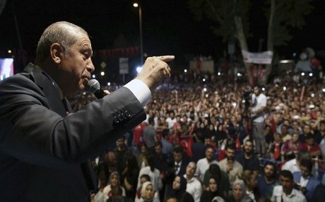 Turkey's President Recep Tayyip Erdogan talking to his supporters gathered in front of his residence in Istanbul after a failed coup attempt July 19