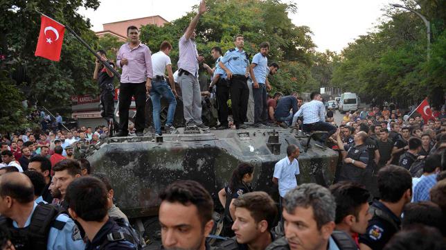 Turkish policemen cordon up around a military vehicle in Ankara Turkey