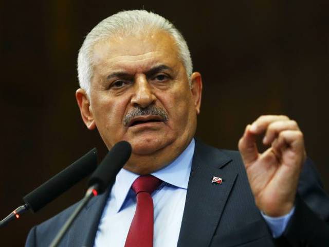 Turkish Prime Minister Binali Yildrim addresses members of parliament from his ruling AK Party during a meeting at the Turkish parliament in Ankara Turkey