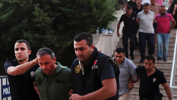 Members of Turkey armed forces are escorted by police for their suspected involvement in Friday's attempted coup at the court house in Mugla a Mediterrenean city of Turkey