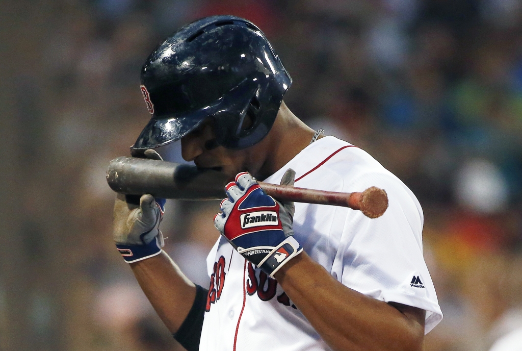 Boston Red Sox's Xander Bogaerts walks to the dug out after striking out during the second inning of a baseball game against the Minnesota Twins in Boston Saturday