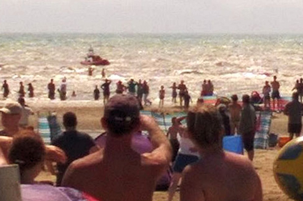 Two men were rescued and one was missing at Camber Sands in East Sussex yesterday