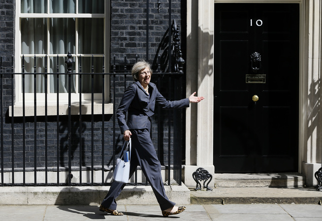 Britain's Home Secretary Theresa May gestures as she leaves after attending a cabinet meeting at 10 Downing Street in London Tuesday