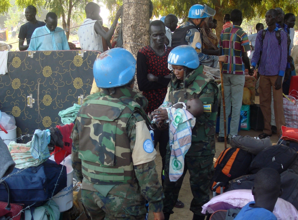 14 2016 and released by the United Nations Mission in South Sudan, UN peacekeeper soldiers hold a baby as South Sudanese people seek protection at the UN camp in Juba South Sudan. Some South Sudanese even tho