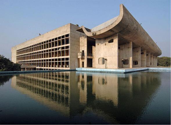 NATURAL AND MANMADE DELIGHTS:A view of the Khangchendzonga mountain along the Himalayan range and the Punjab and Haryana Assembly building part of the Capitol Complex designed by French architect Le Corbusier in Chandigarh.— File