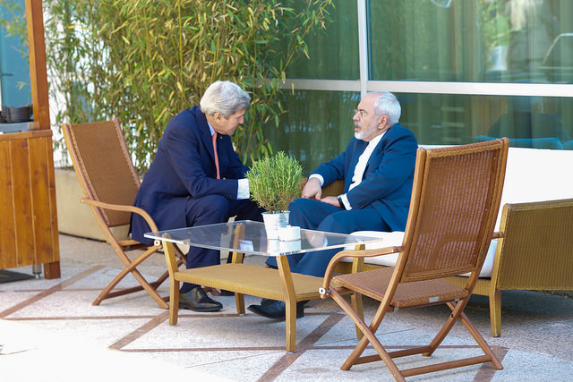 State via Flickr. U.S. Secretary of State John Kerry sits with Iranian Foreign Minister Javad Zarif for a one-on-one chat before a broader meeting in Geneva Switzerland