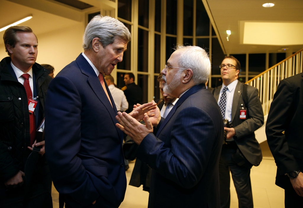 Secretary of State John Kerry talks with Iranian Foreign Minister Mohammad Javad Zarif in Vienna after the International Atomic Energy Agency verified that Iran has met all conditions under the nuclear