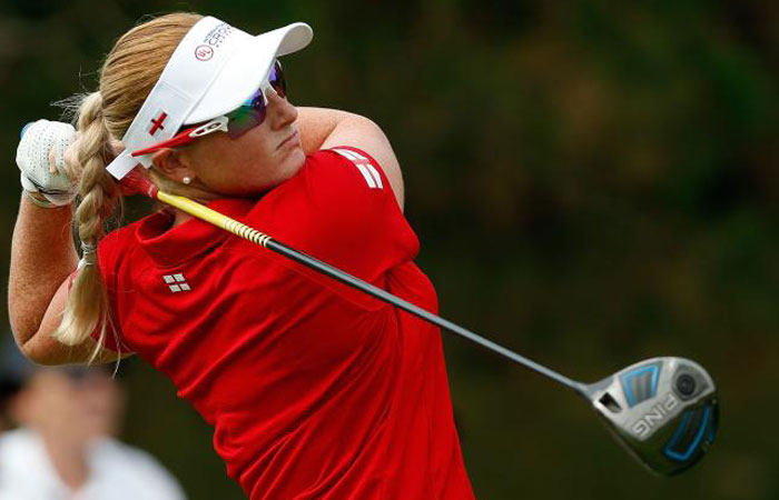 Holly Clyburn of England hits her tee shot on the third hole during the four-ball session of the 2016 UL International Crown at the Merit Club in Chicago Illinois Thursday. — AFP