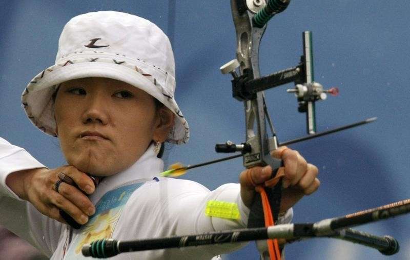 Park Sung-hyun of South Korea takes aim during her women's individual semi-final archery round against Kwon Un-sil of North Korea at the Beijing 2008 Olympic Games