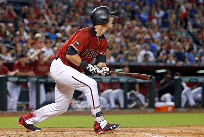 Arizona Diamondbacks&#39 Jake Lamb watches the flight of his home run against the Los Angeles Dodgers during the third inning of a baseball game Sunday